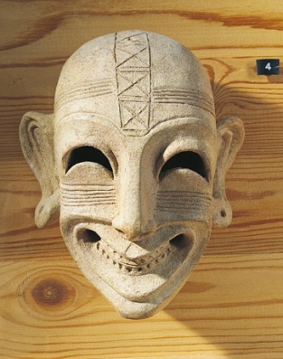 A fourth-century B.C. Phoenician mask found in Tunisia displays a grin not unlike those seen on victims of an ancient Phoenician "sardonic grin" potion administered on the island of Sardinia.  Scientists in May 2009 said they had finally uncovered the source of the potion's lethal, smile-inducing effects: the hemlock water-dropwort plant.