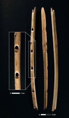 A bone flute from Hohle Fels with enlarged image of finger holes